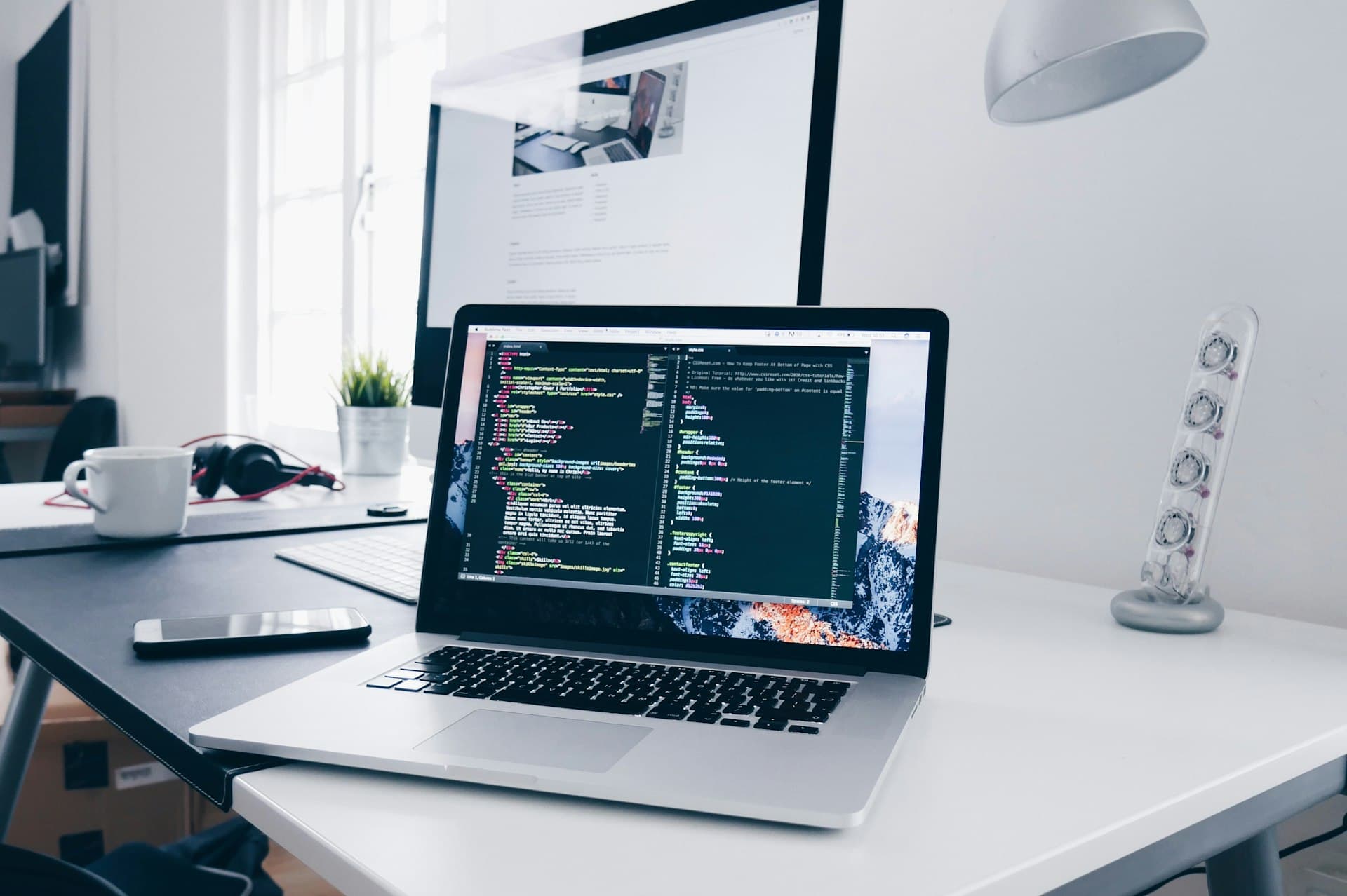 Developer workspace with code on MacBook